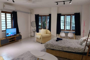 5-Person 1950s Shophouse: Vintage Charm & Smart TVs
